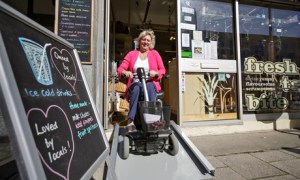 disabled person using portable ramp