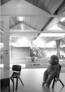 classroom with child's toy monkey sat on chair