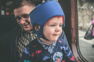 little boy travelling on public transport