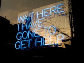 wait here I've gone for help written in neon