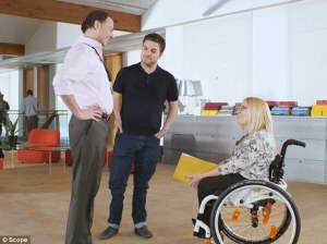 Able person in patronising conversation with wheelchair user 