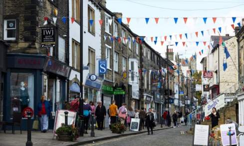 busy small town street with bunting 